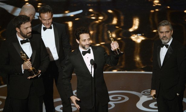 Ben Affleck, Grant Heslov and George Clooney collect the best picture Oscar for Argo