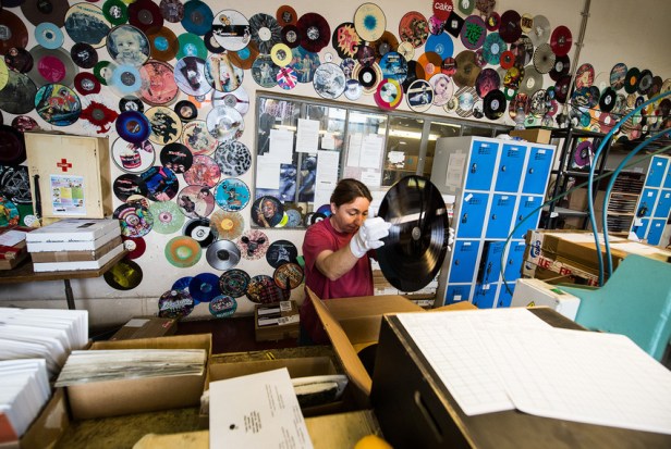 epa04346871 Employee Iva Mangova works at the Creation Process Department of the GZ Media vinyl record factory in Lodenice, Czech Republic, 05 August 2014. The former 'Gramofonove Zavody (Gramophone Record) Lodenice' factory pressed its first vinyl record in 1951. The factory was main producer of vinyl records for the Eastern Bloc. Vinyl Record Day is celebrated annually by many collectors on 12 August.  EPA/FILIP SINGER